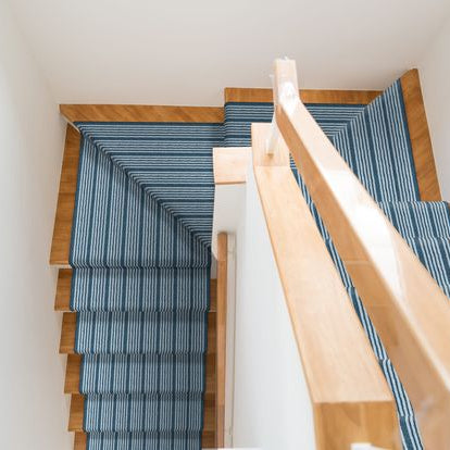 |||Detail on stairway with glass railing in a new modern building.||