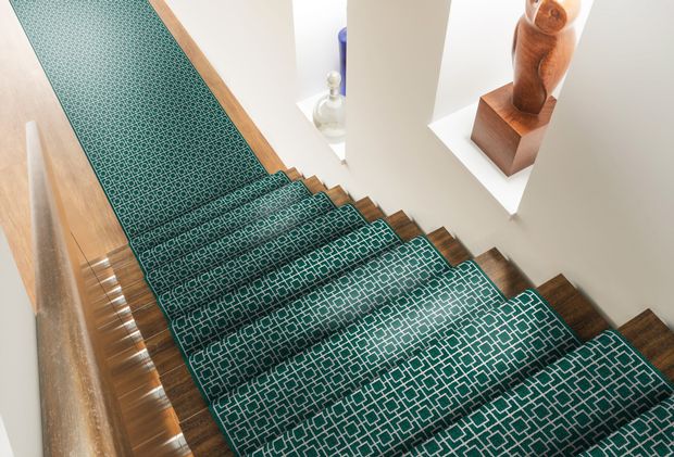 Wooden staircase with Green stair runner