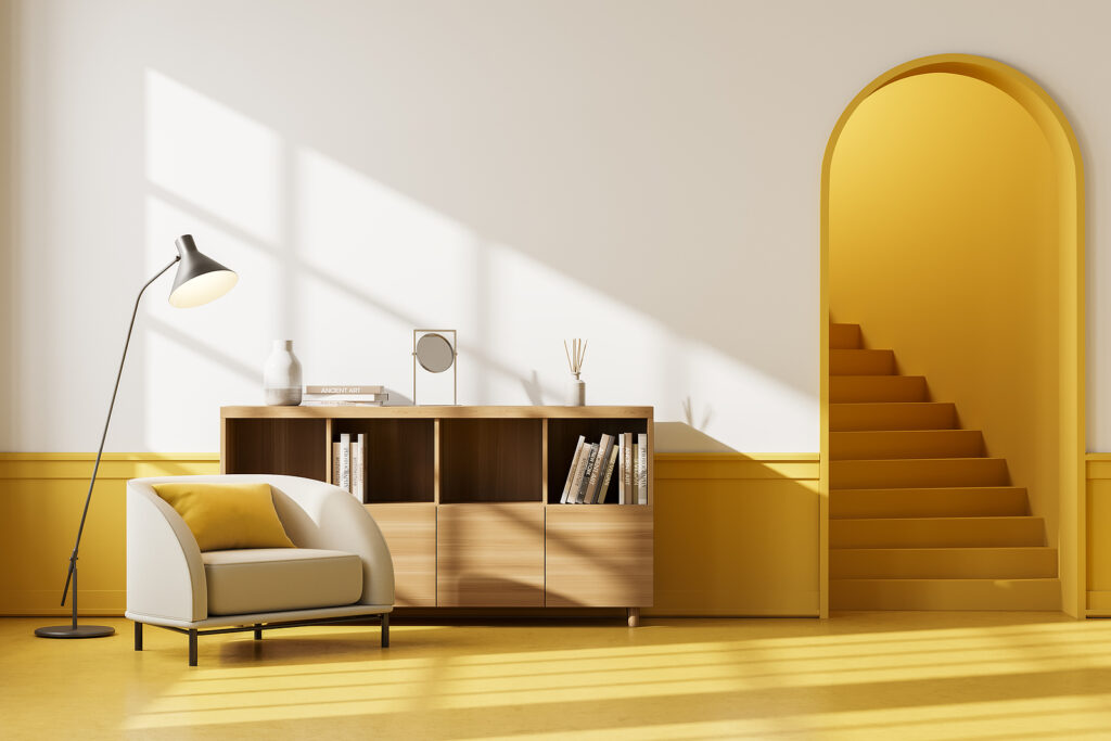 Apartment interior with beige seat and drawer with books and decoration, yellow floor. Mockup blank wall copy space, staircase with arch door, 3D rendering
